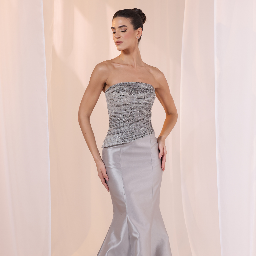 Shop online elegant gown with textured strapless bodice, subtle shimmer and smooth satin skirt, perfect for parties and special occasions.