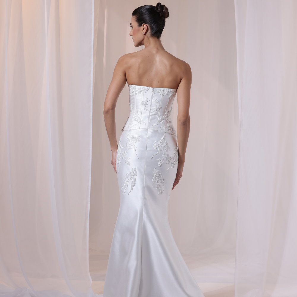 Shop online refined ivory gown with structured lace corset bodice and smooth satin silhouette, perfect for weddings, parties and special occasions.