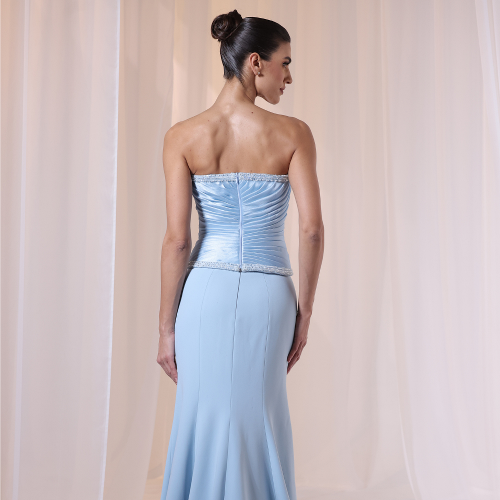 Shop online light blue gown with structured corset bodice, soft pleated details and sleek elegant silhouette, perfect for parties and special occasions.