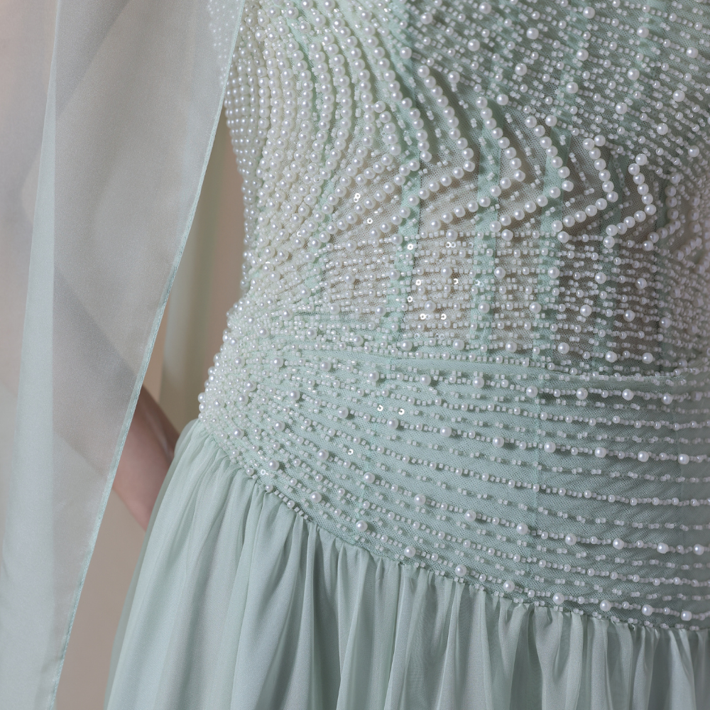 Shop online soft mint gown with shimmering beadwork, sheer draped scarf and flowing silhouette, perfect for parties, receptions and special occasions.