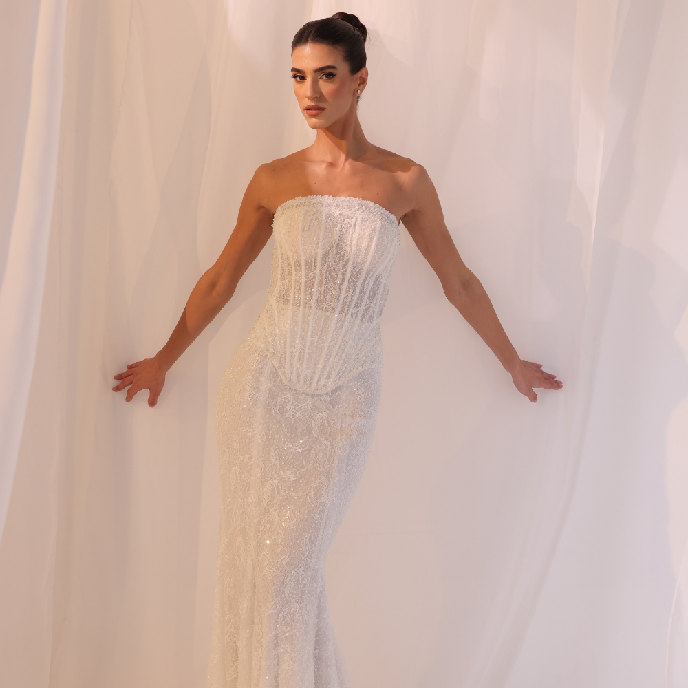 Shop online champagne strapless gown with delicate shimmering embellishments and sleek fitted silhouette, perfect for parties, receptions and special occasions.