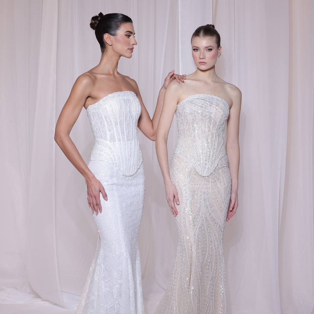 Shop online soft ivory gown with delicate shimmer, structured corset bodice and elegant fitted silhouette, perfect for parties and special occasions.