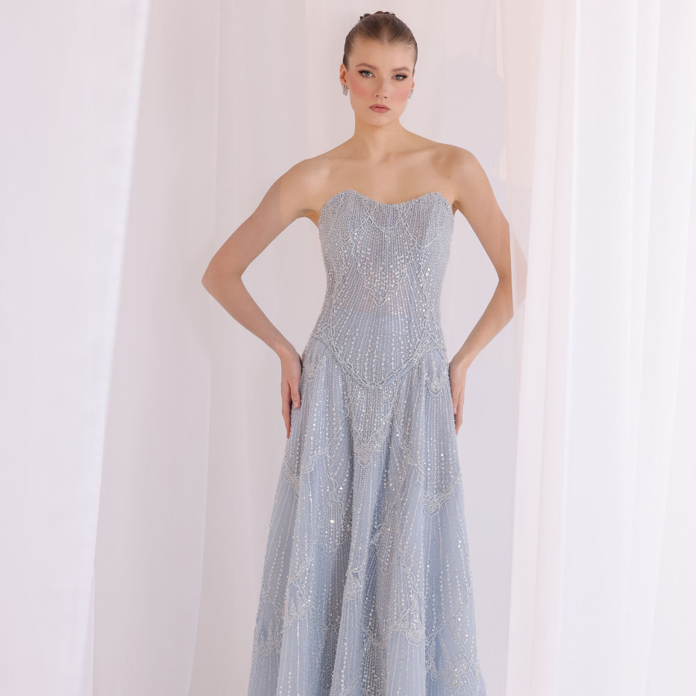 Shop online soft blue gown with subtle shimmer and flowing textured layers, perfect for parties, evening events and special occasions.