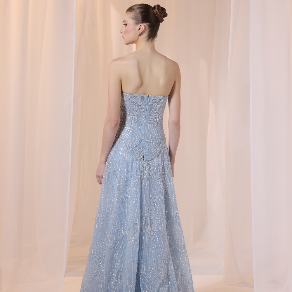 Shop online soft blue gown with subtle shimmer and flowing textured layers, perfect for parties, evening events and special occasions.