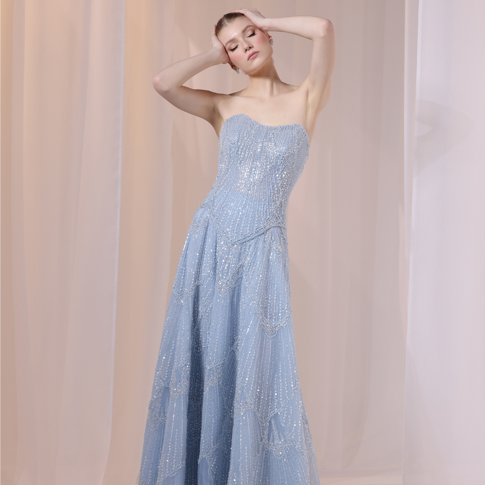 Shop online soft blue gown with subtle shimmer and flowing textured layers, perfect for parties, evening events and special occasions.