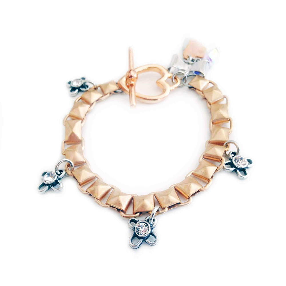 Bracelet made with Crystallized Swarovski elements and silver and rose gold plated brass charms and chains.