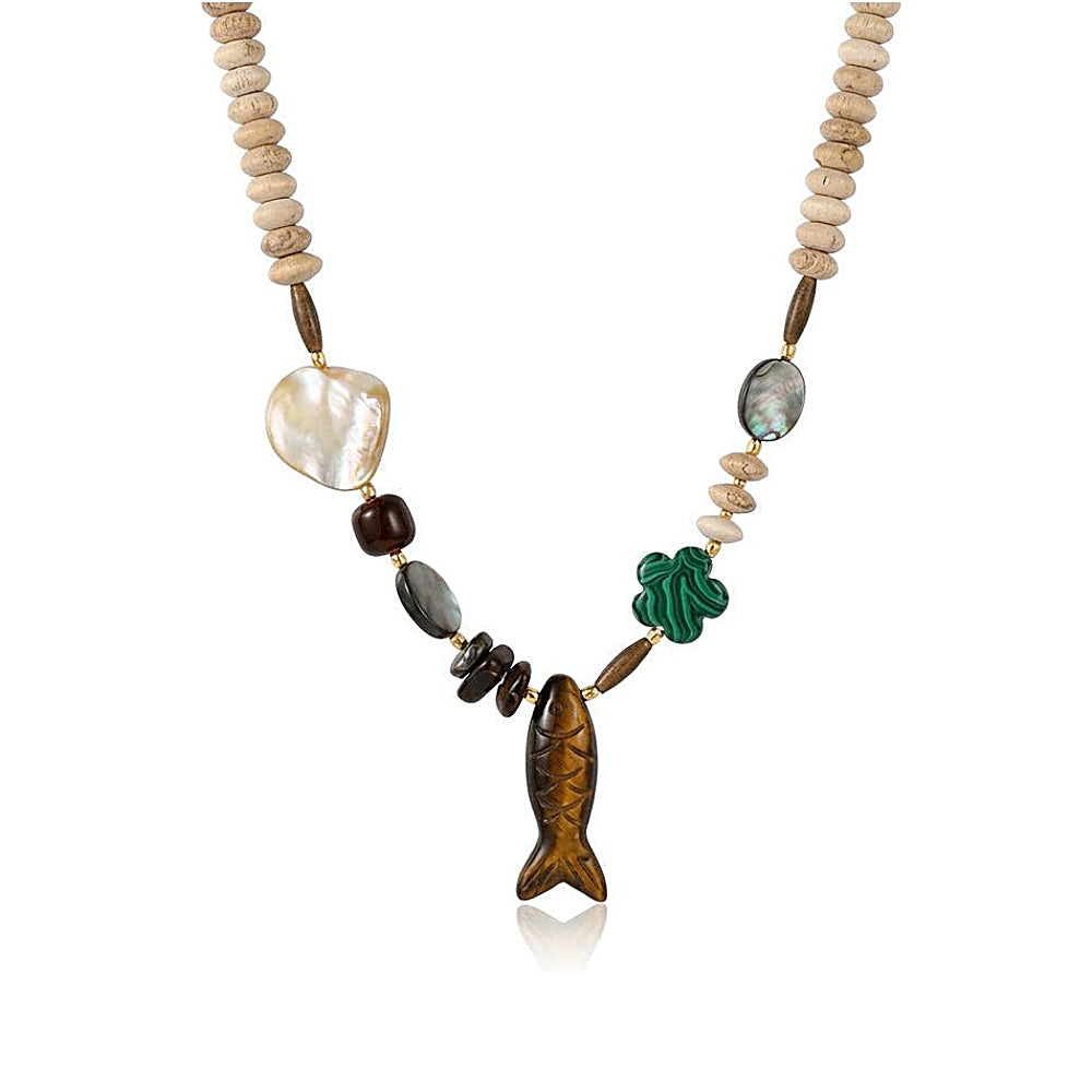 Discover the Lucky Fish Mixed Stone Necklace at The Luxe Maison, featuring a carved fish charm, tiger's eye, malachite, mother-of-pearl, and natural stone beads for a unique, meaningful look inspired by luck and abundance.