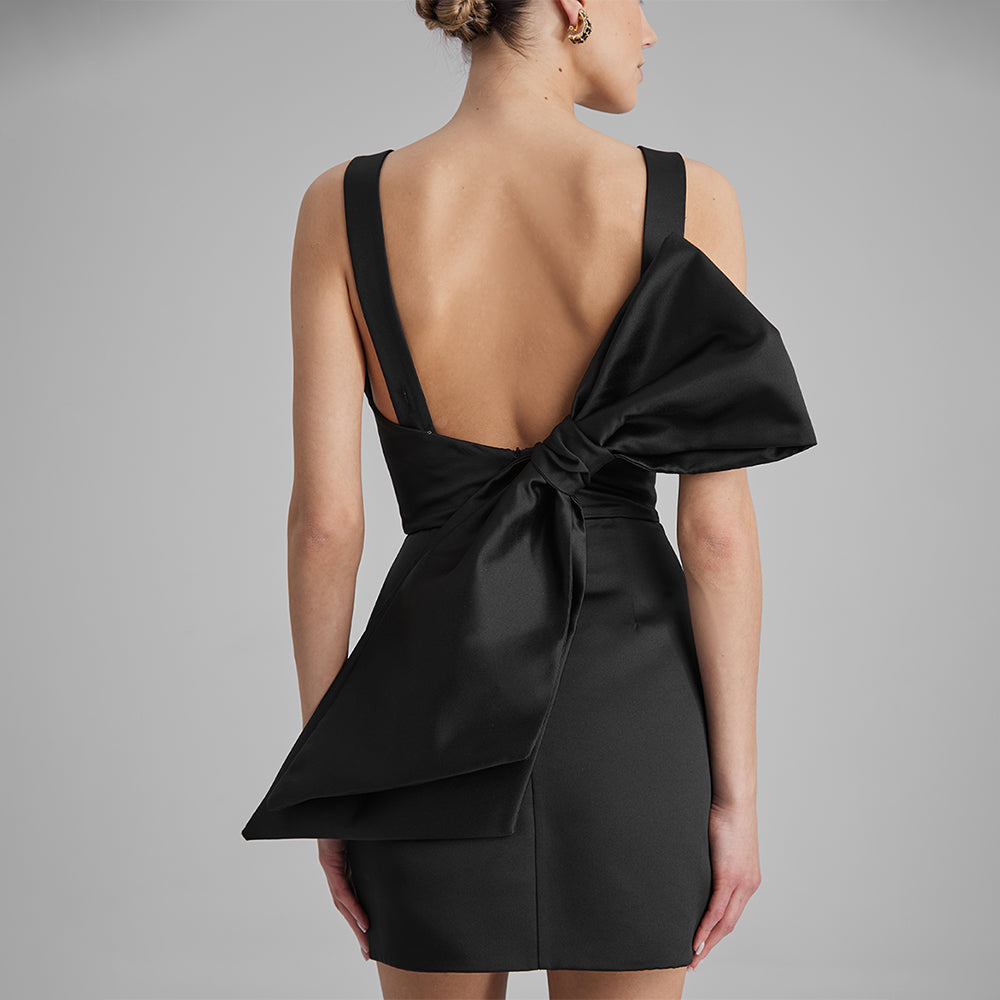 Explore contemporary elegance with our black mini dress with a strapless corset & removable side bow. Shop exclusive dresses for women. Shop now!