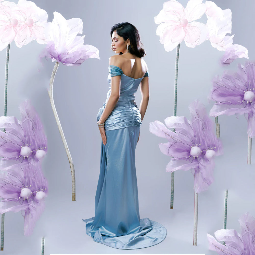 Light blue off shoulder gown with sweetheart neck and ruched fit, perfect for events. Shop online from our exclusive collection of premium styles.