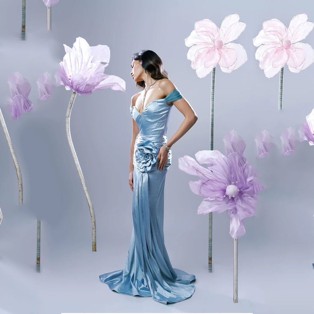 Light blue off shoulder gown with sweetheart neck and ruched fit, perfect for events. Shop online from our exclusive collection of premium styles.