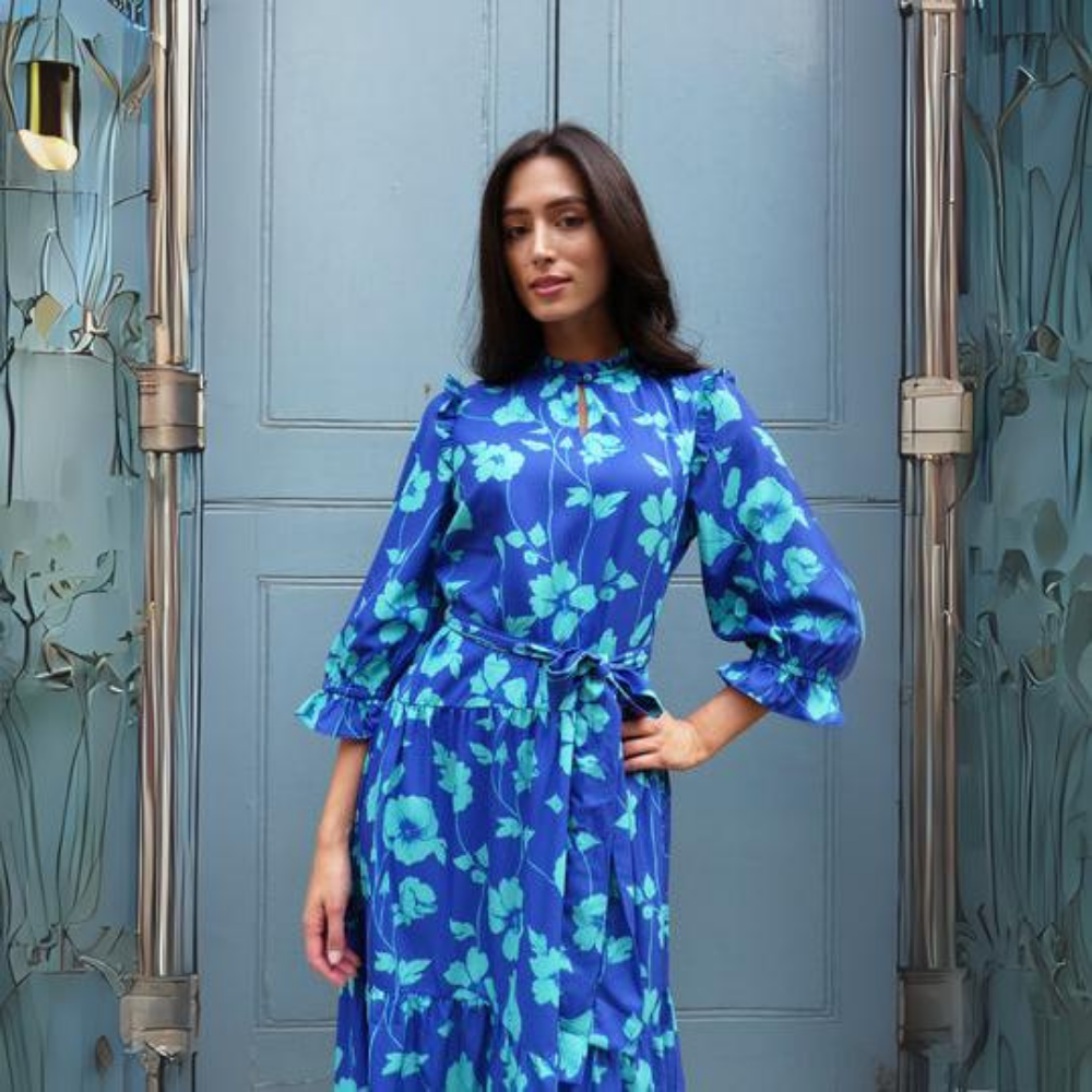 This elegant dress features a stunning floral print in blue tones. 
