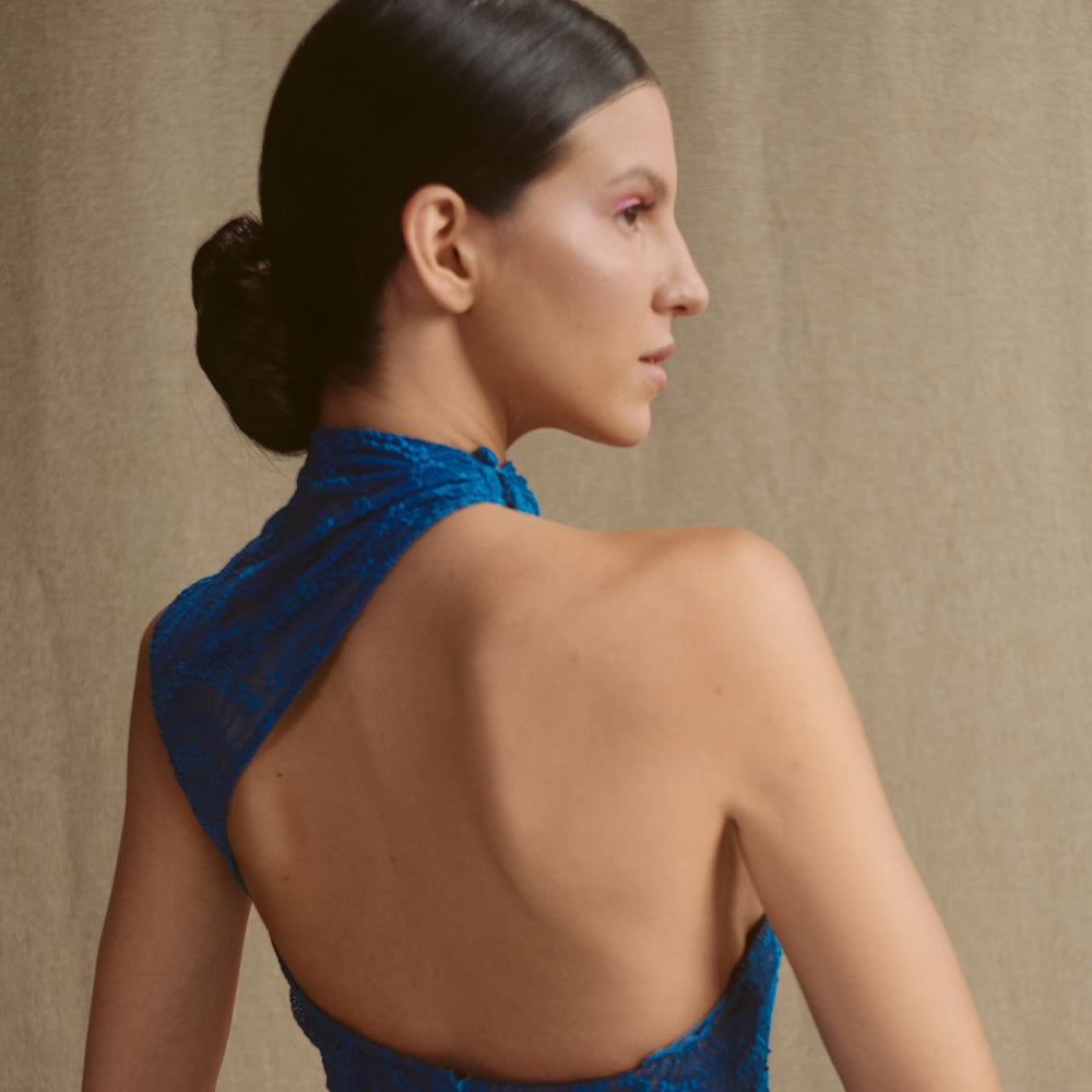 Body-Hugging lace dress, one-shoulder asymmetric neckline with open back.