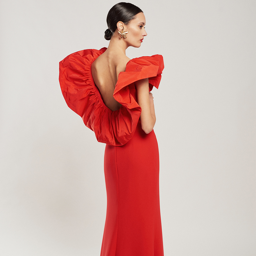 Long red crepe dress with a technical fabric ruffle. Perfect for an evening wedding & party wear. The crepe body will adjust to your body. Shop now!