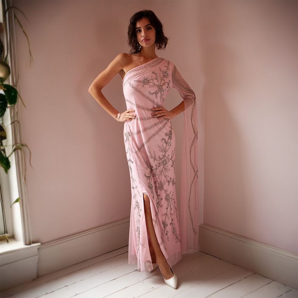 Our stunning pink maxi gown! Made with high-quality polyester, this lightweight dress features delicate beading 