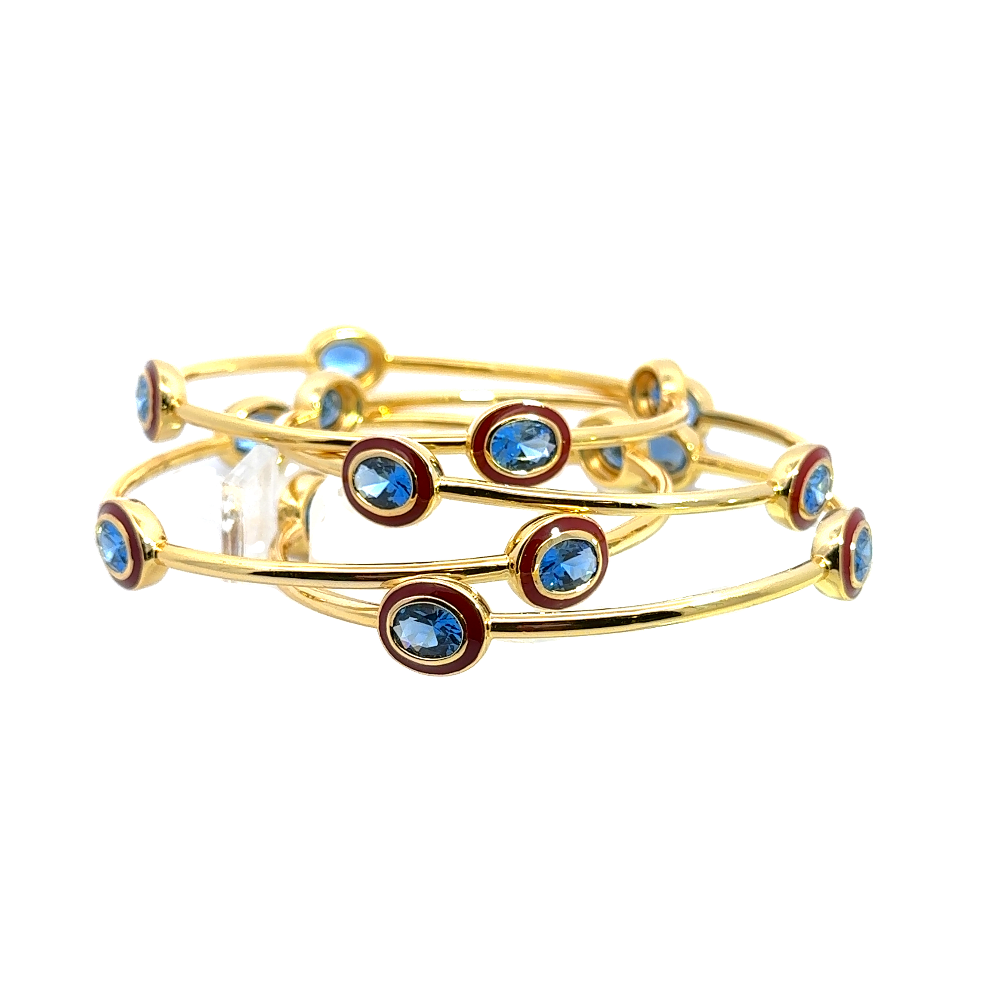Bohemian 22K gold plated bangle with sparkling oval created Spinel and red enamel detailing. Perfect for stacking or statement styling. Shop premium jewelry online.