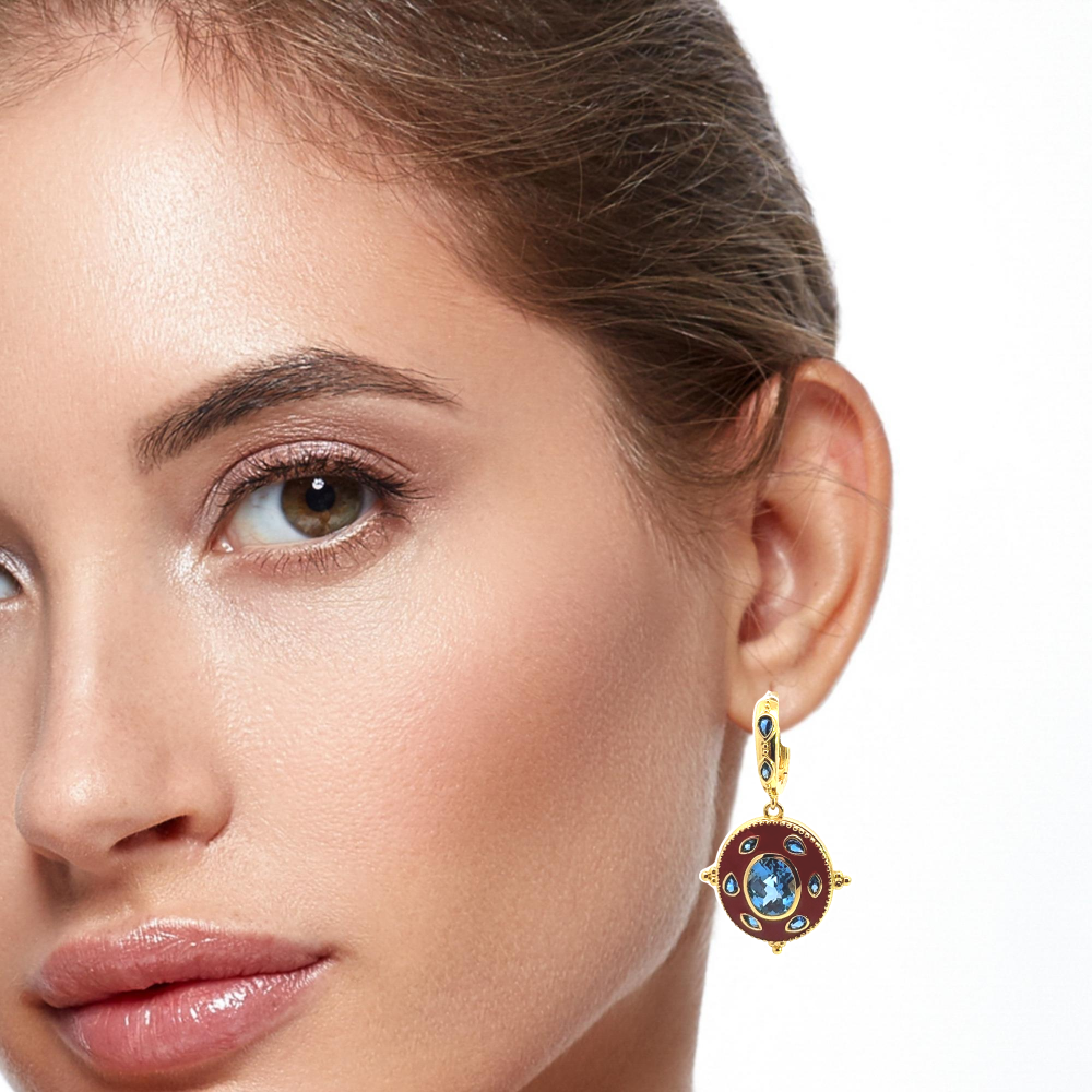 Statement 22K gold plated drop earrings with faceted created Spinel, marquise accents, and rich red enamel detailing. Perfect for elegant occasions. Shop premium jewelry online.
