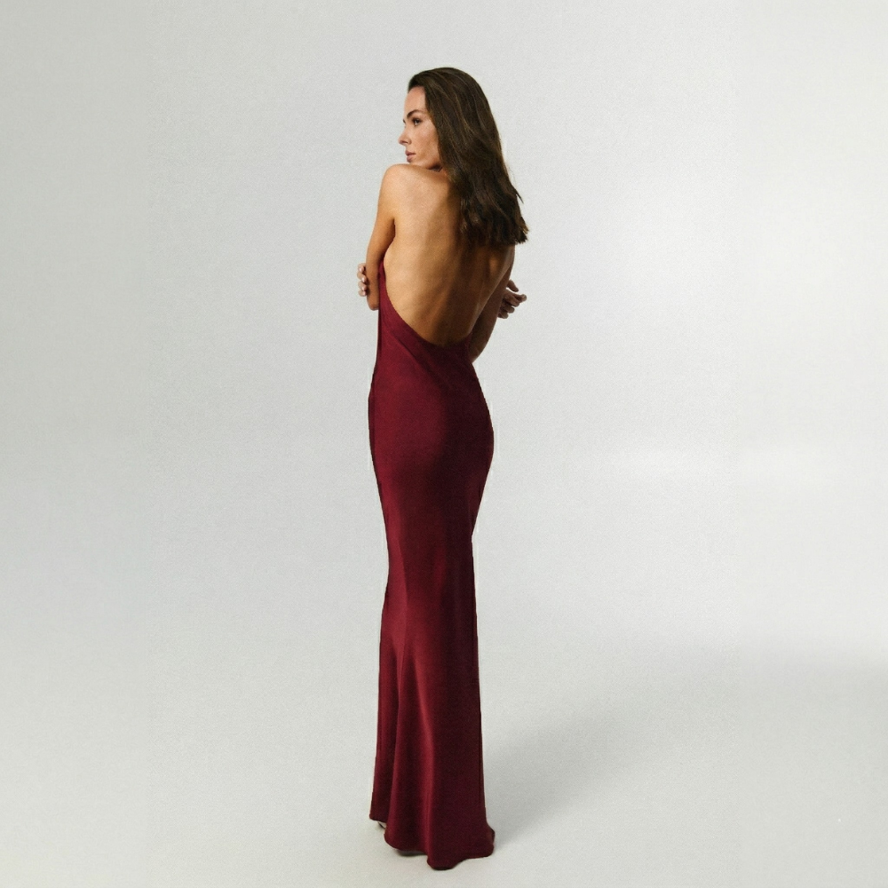 Mermaid-shaped dress with a perfect body-hugging fit and elegant open back. Shop now at our exclusive clothing website.