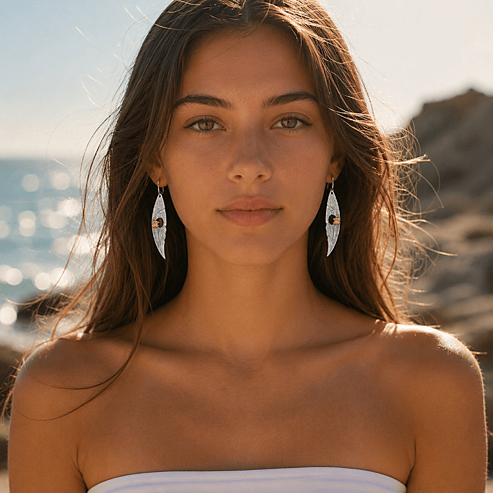 Discover the Meditating Buddha Mother-of-Pearl Earrings at The Luxe Maison, featuring shimmering black mother-of-pearl, an iridescent silver-blue finish, and a delicate golden Buddha accent. Inspired by mindfulness and inner peace, these elegant earrings bring a meaningful, serene touch to everyday style and special occasions.