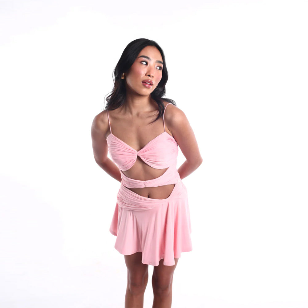 Blush pink mini dress with bustier and cut outs, perfect for parties. Shop online from our curated edit of premium fashion.