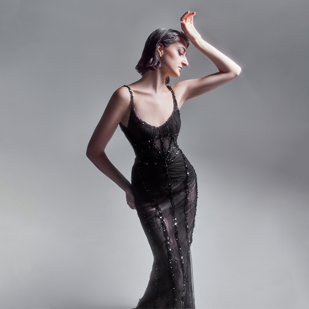 Mermaid Black Chantilly lace Dress, with draped tulle details and embellished bands highlighting a structured silhouette.