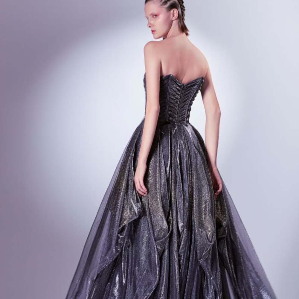 This dress radiates with every movement as gold and silver shimmers sparkle from the black tulle jersey base.