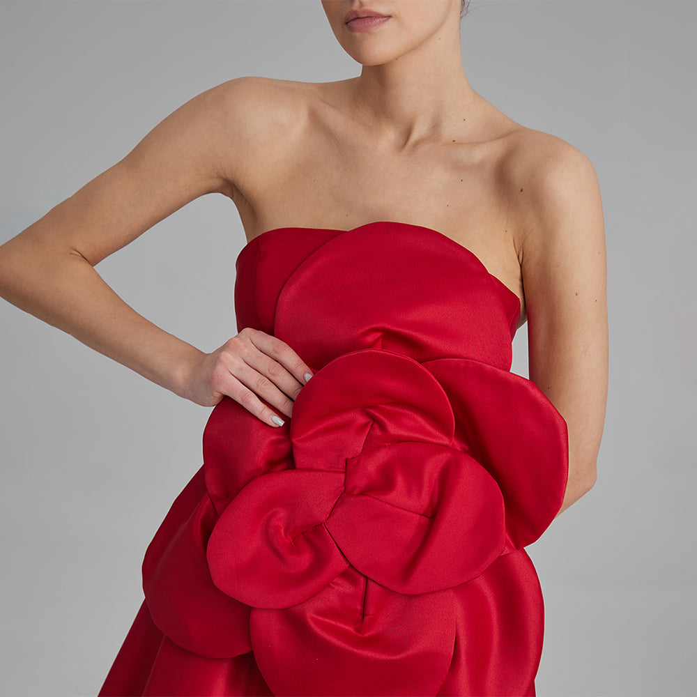 Explore our Red Midi Dress with a removable flower bow. Elevate your wardrobe with this timeless piece. Shop designer dresses for women. Shop now!