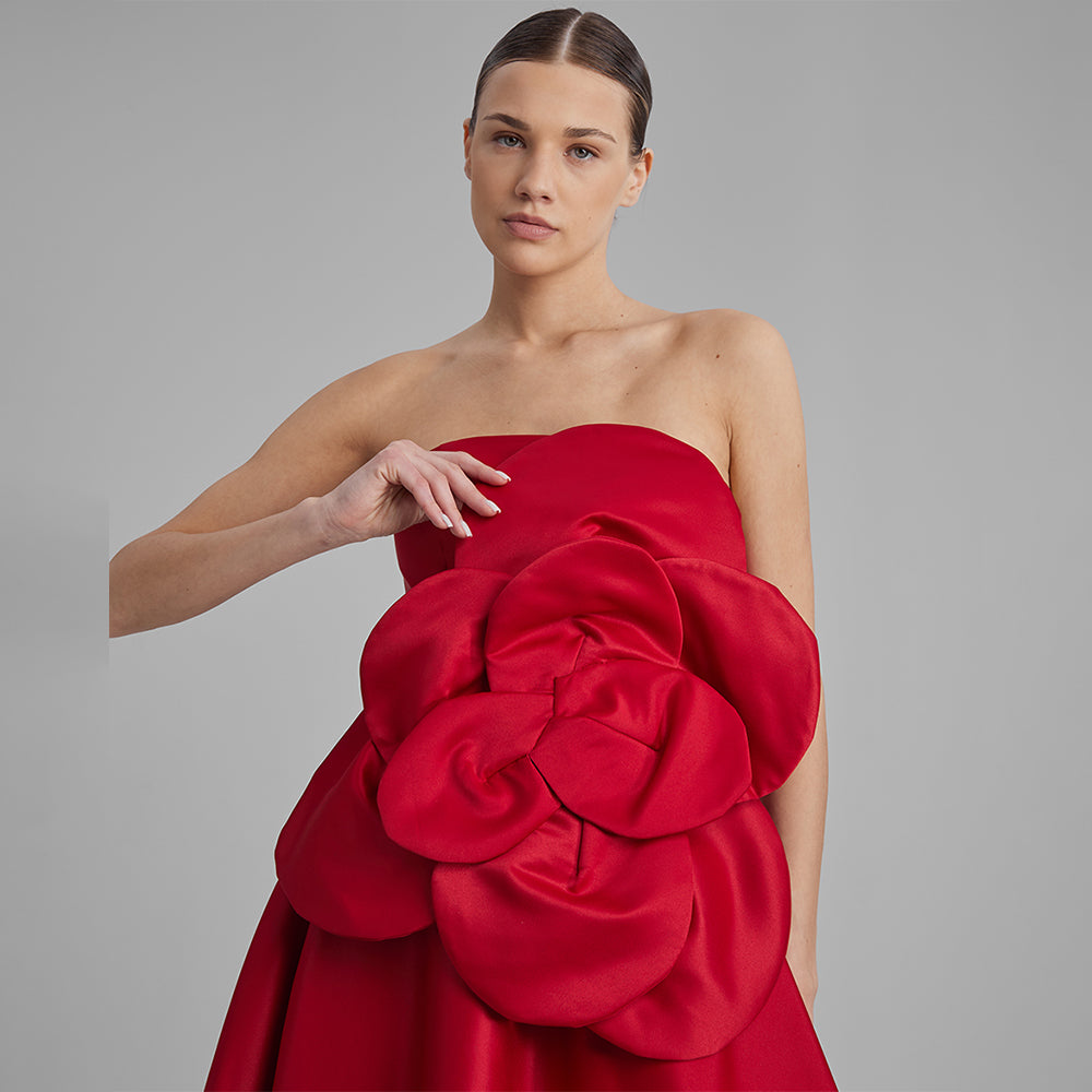 Explore our Red Midi Dress with a removable flower bow. Elevate your wardrobe with this timeless piece. Shop designer dresses for women. Shop now!