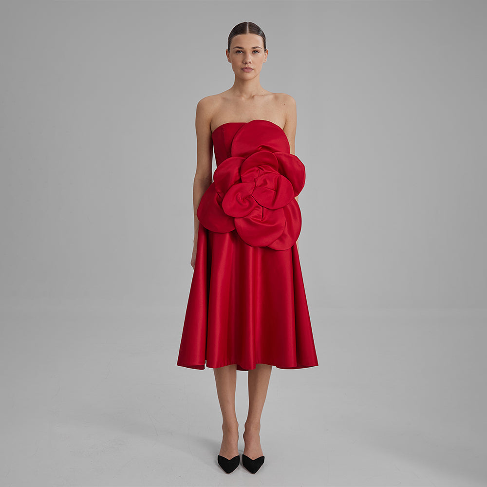 Explore our Red Midi Dress with a removable flower bow. Elevate your wardrobe with this timeless piece. Shop designer dresses for women. Shop now!