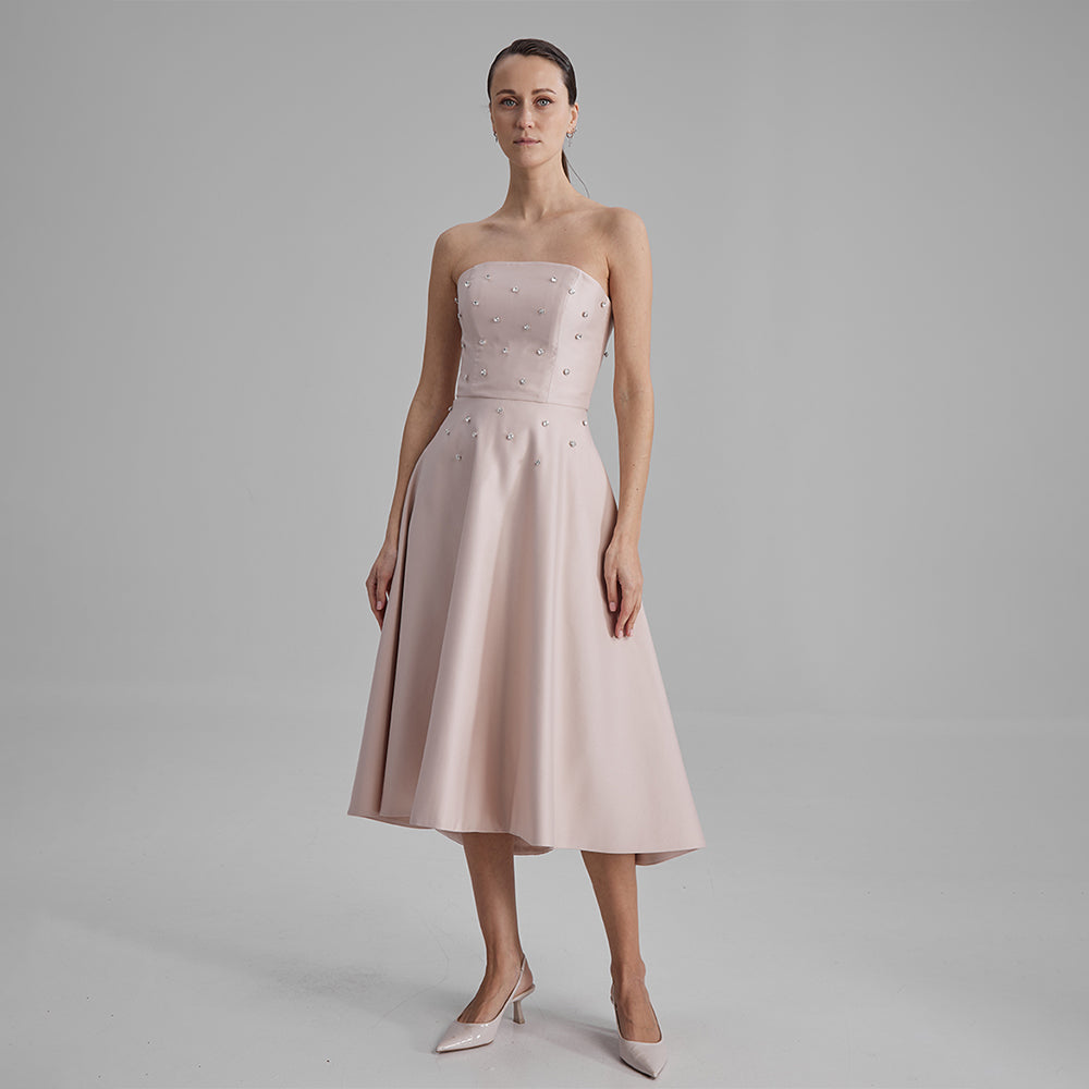 Shop midi nude dress with diamonds. Elevate your wardrobe with this timeless piece for seamless transitions. Shop designer dresses for women. Shop now!