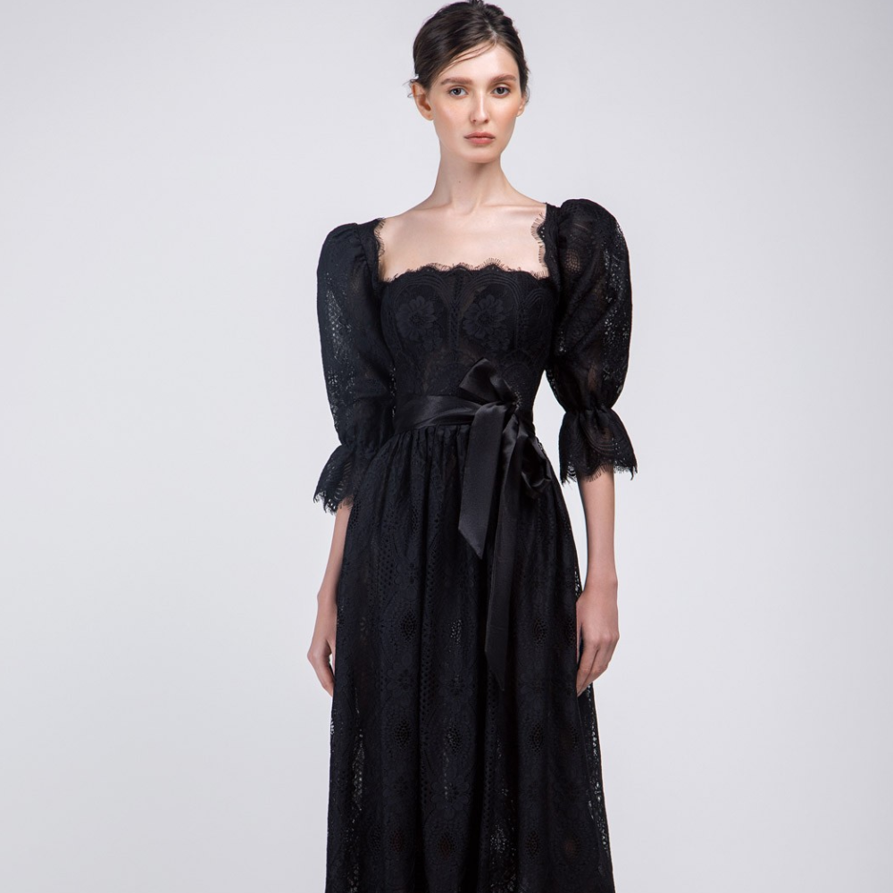 This is a black color lace fabric 3/4 sleeves below knee length frock.