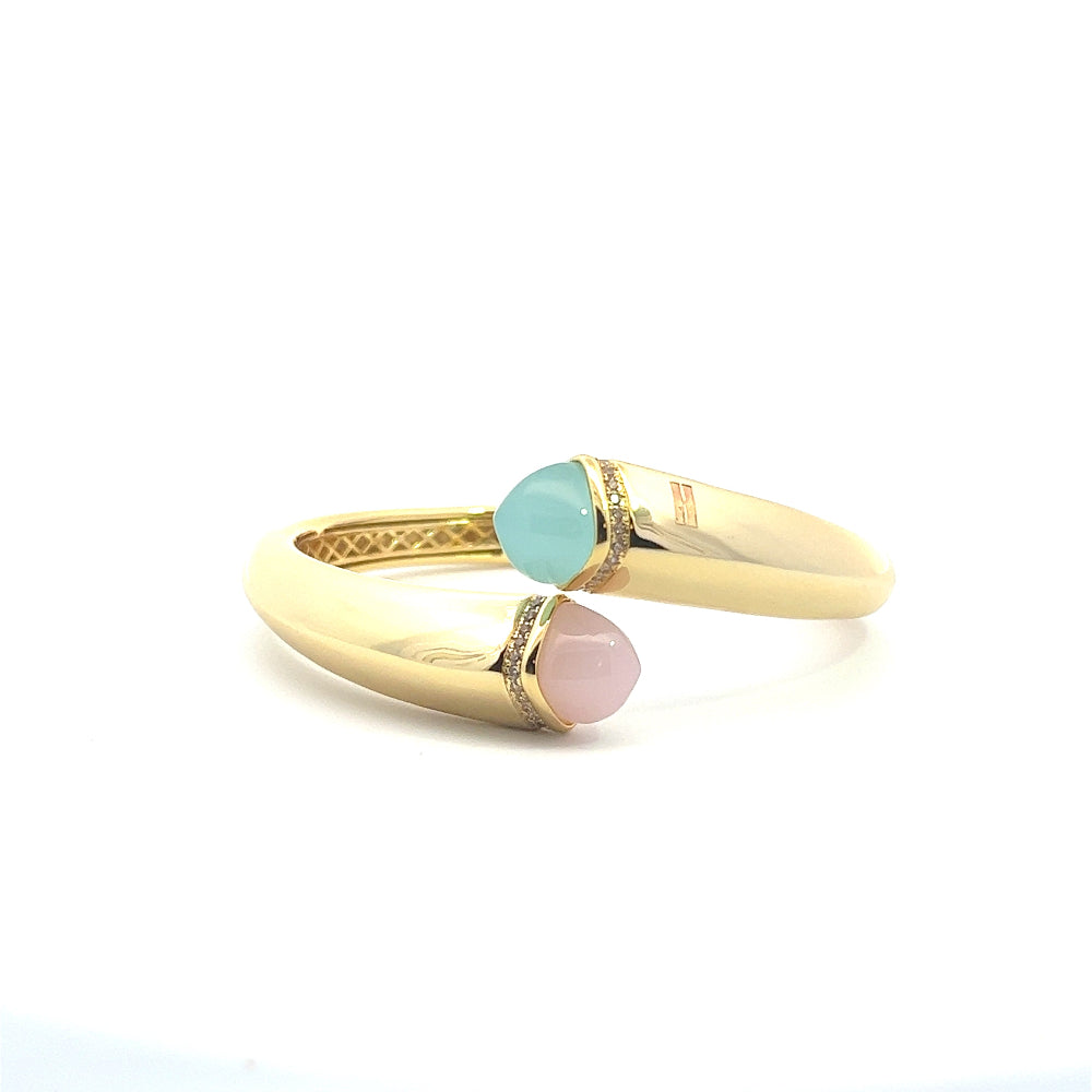 Elegant yellow gold plated cuff bracelet with colored pyramidal crystals and sparkling pavé cubic zirconia accents. Perfect for luxe everyday styling. Shop premium jewelry online.