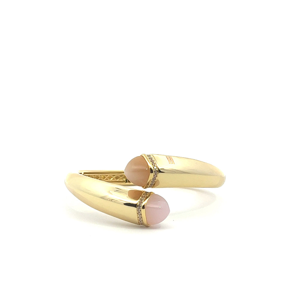 Elegant yellow gold plated cuff bracelet with colored pyramidal crystals and sparkling pavé cubic zirconia accents. Perfect for luxe everyday styling. Shop premium jewelry online.