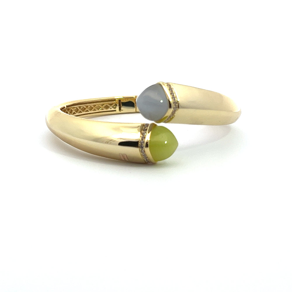 Elegant yellow gold plated cuff bracelet with colored pyramidal crystals and sparkling pavé cubic zirconia accents. Perfect for luxe everyday styling. Shop premium jewelry online.