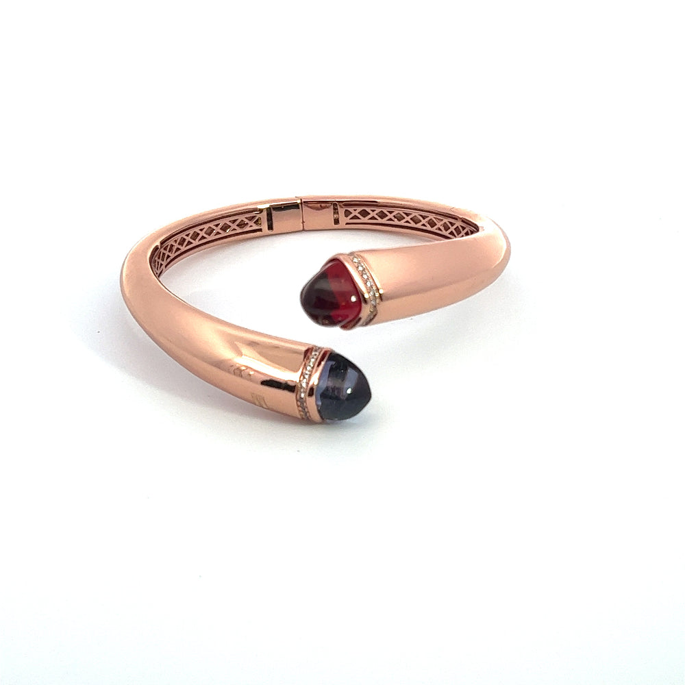 Elegant rose gold plated cuff bracelet with colored pyramidal crystals and pavé cubic zirconia accents. A chic luxe accessory for every occasion. Shop premium jewelry online.
