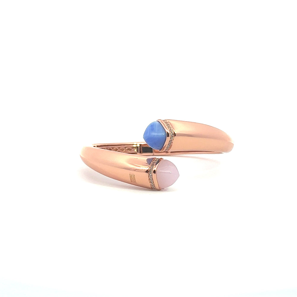 Elegant rose gold plated cuff bracelet with colored pyramidal crystals and pavé cubic zirconia accents. A chic luxe accessory for every occasion. Shop premium jewelry online.
