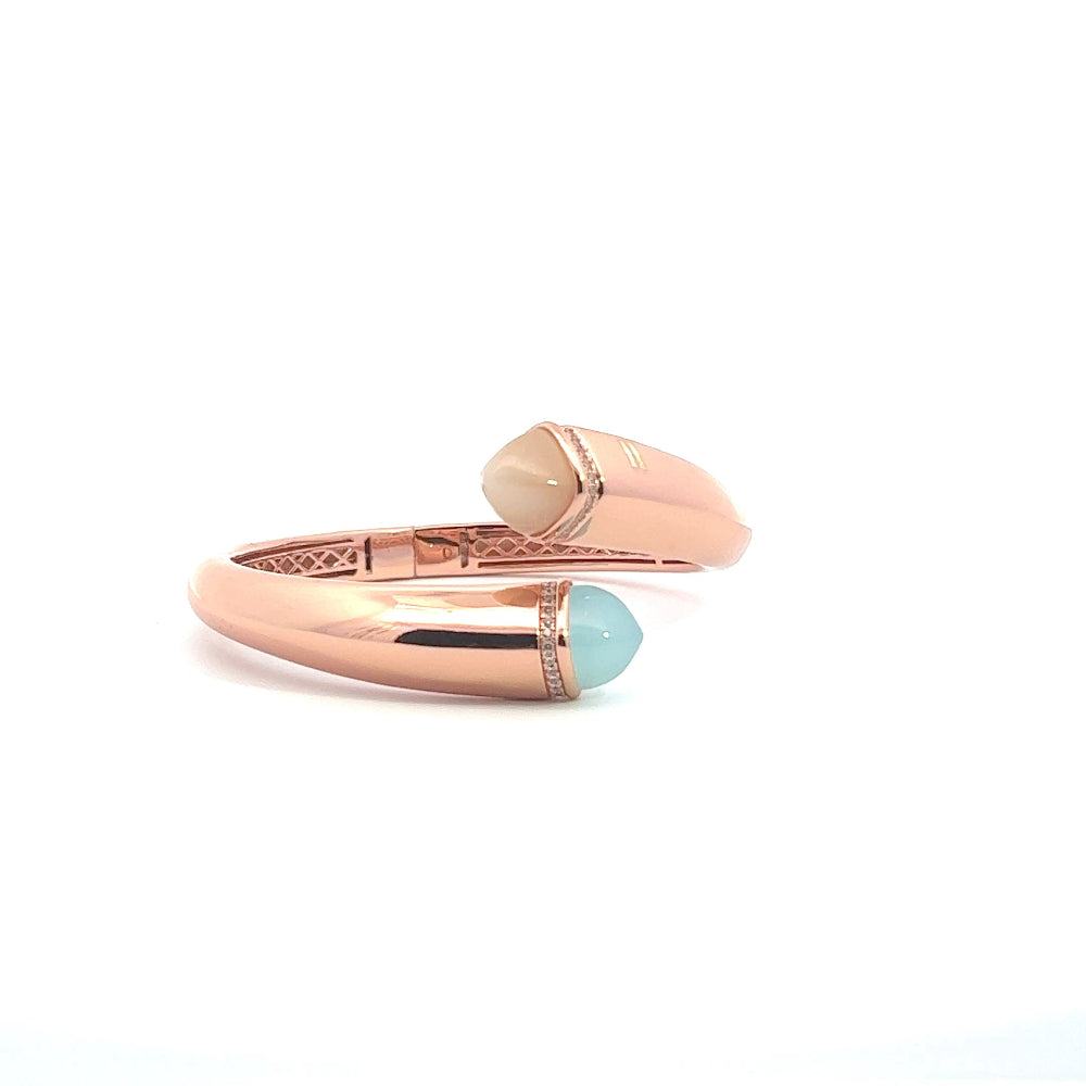 Elegant rose gold plated cuff bracelet with colored pyramidal crystals and pavé cubic zirconia accents. A chic luxe accessory for every occasion. Shop premium jewelry online.