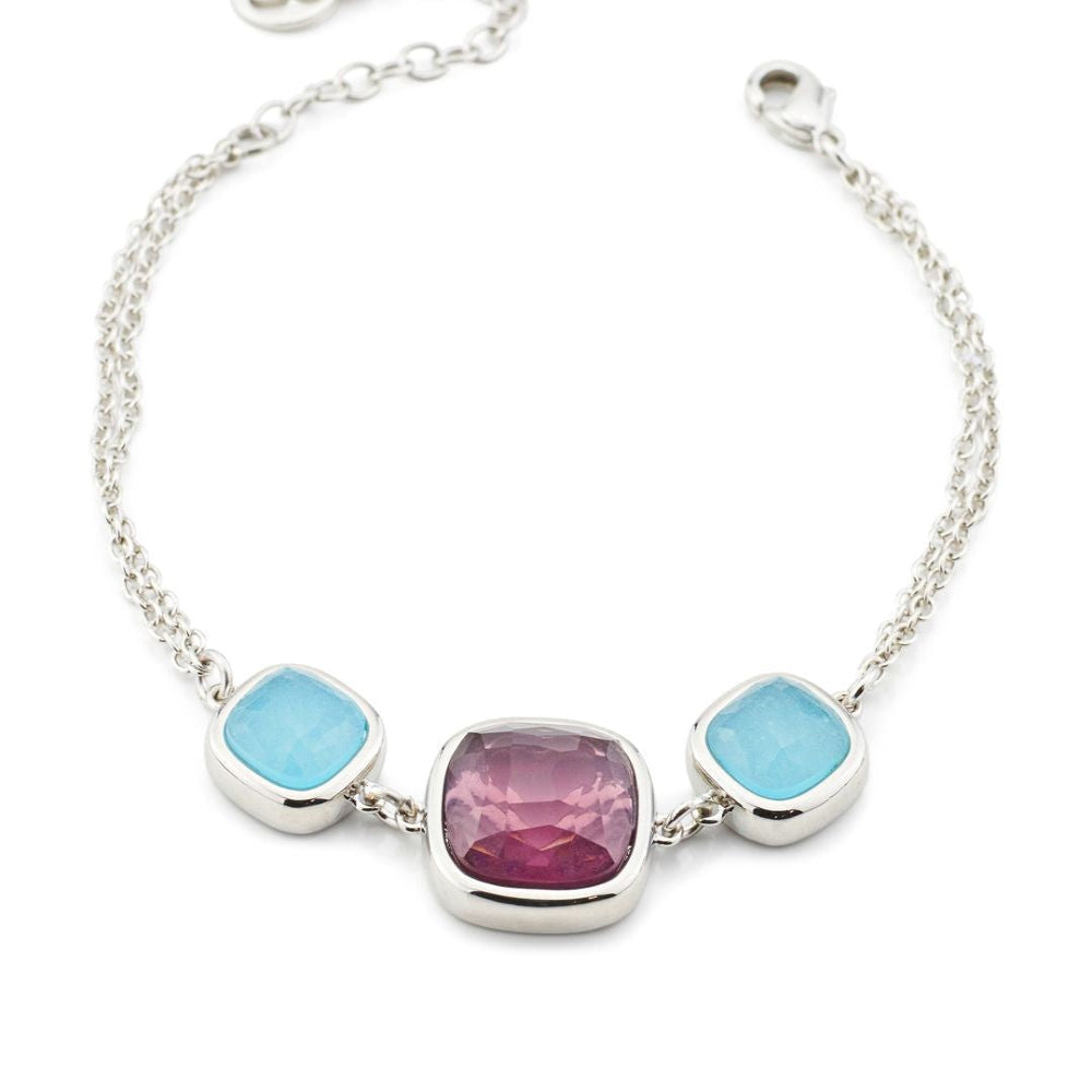 Rhodium-plated bronze bracelet featuring a large purple amethyst crystal paired with soft milky blue aquamarine accents for a contemporary finish. Shop premium jewelry online.