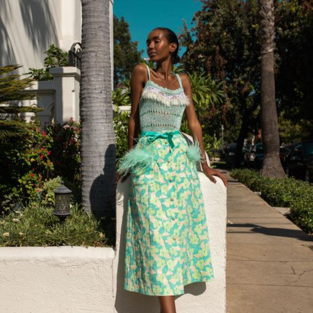 Mint Skirt With Feather Details is cut from a lightweight cotton with a hint of stretch.