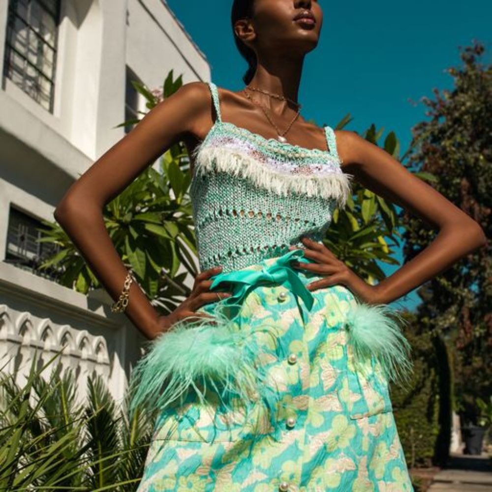 Mint Skirt With Feather Details is cut from a lightweight cotton with a hint of stretch.