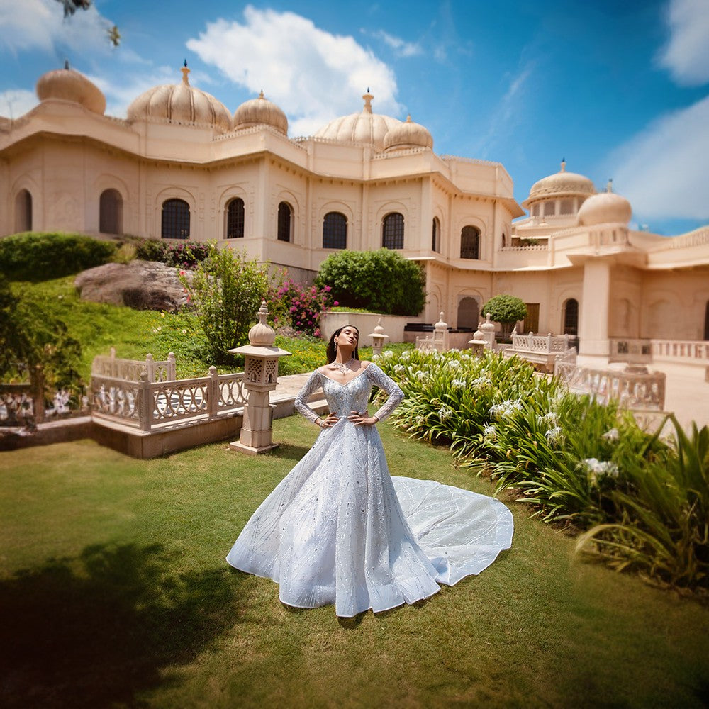 Scintillating Cosmos depicted through Signature embroideries over double circular skirt ball gown with imperial train.