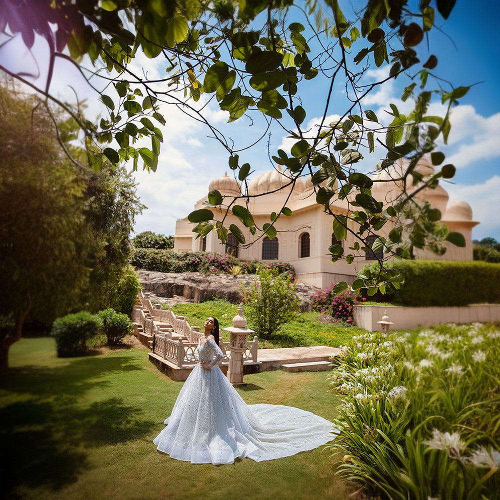 Scintillating Cosmos depicted through Signature embroideries over double circular skirt ball gown with imperial train.