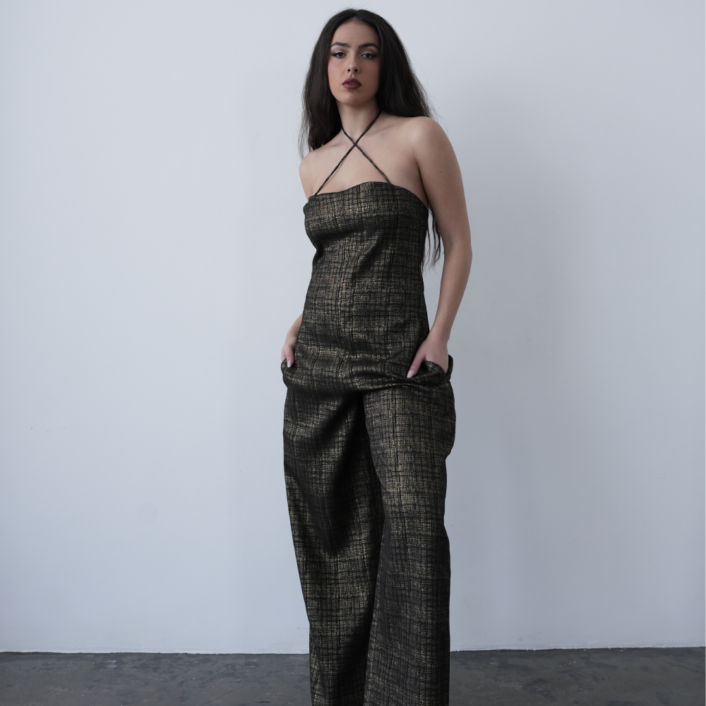 Wide leg sleeveless jumpsuit with pockets and crossover neck detailing.