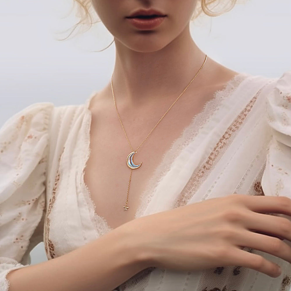 Discover the Moon and Star Lariat Necklace at The Luxe Maison, featuring a celestial-inspired design that adds a touch of elegance and magic to your look.