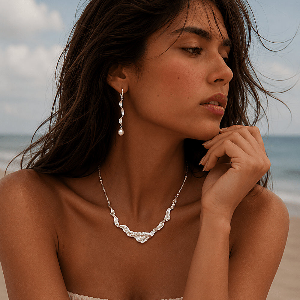 Discover the Moontide Sterling Silver Necklace & Earrings Jewelry Set at The Luxe Maison, featuring sculptural wave-inspired designs in S925 sterling silver for an elegant, timeless look inspired by the sea.