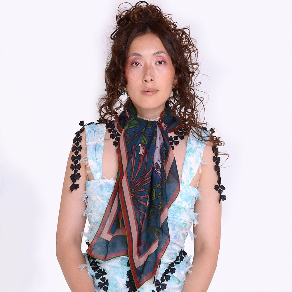 Wrap yourself in luxury with the Mystic Rabbit Silk Chiffon Womens Scarf. Perfect for every style. Add elegance to your wardrobe. Shop Now!