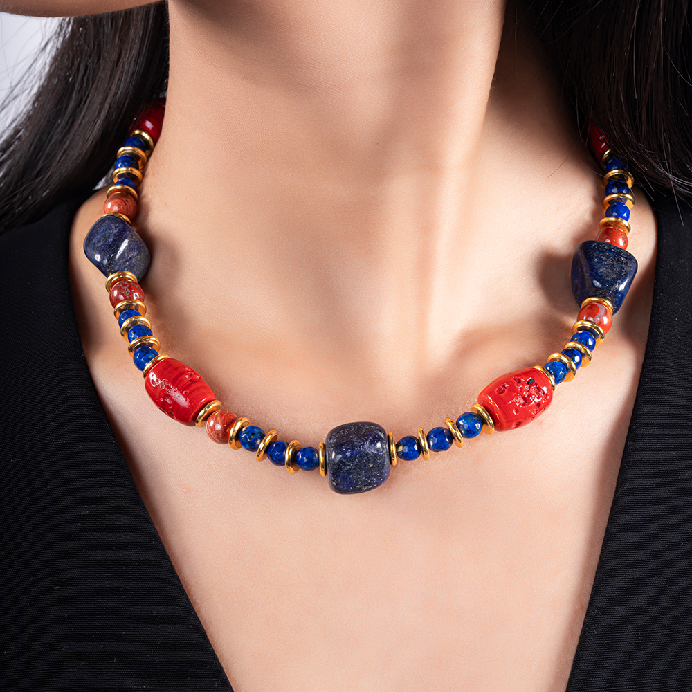 A bold necklace that artfully combines the rich blue hues of Lapis Lazuli with the vibrant shades of coral.