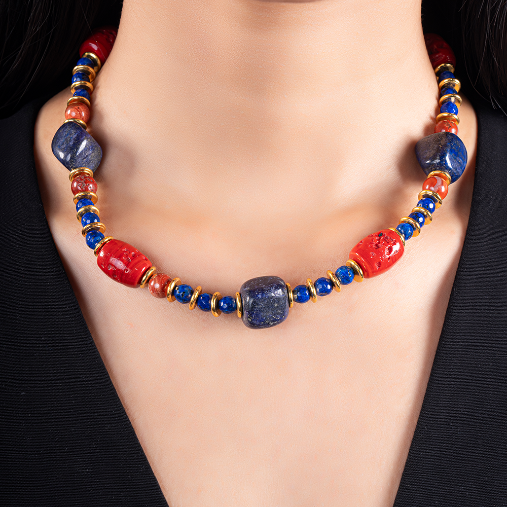 A bold necklace that artfully combines the rich blue hues of Lapis Lazuli with the vibrant shades of coral.