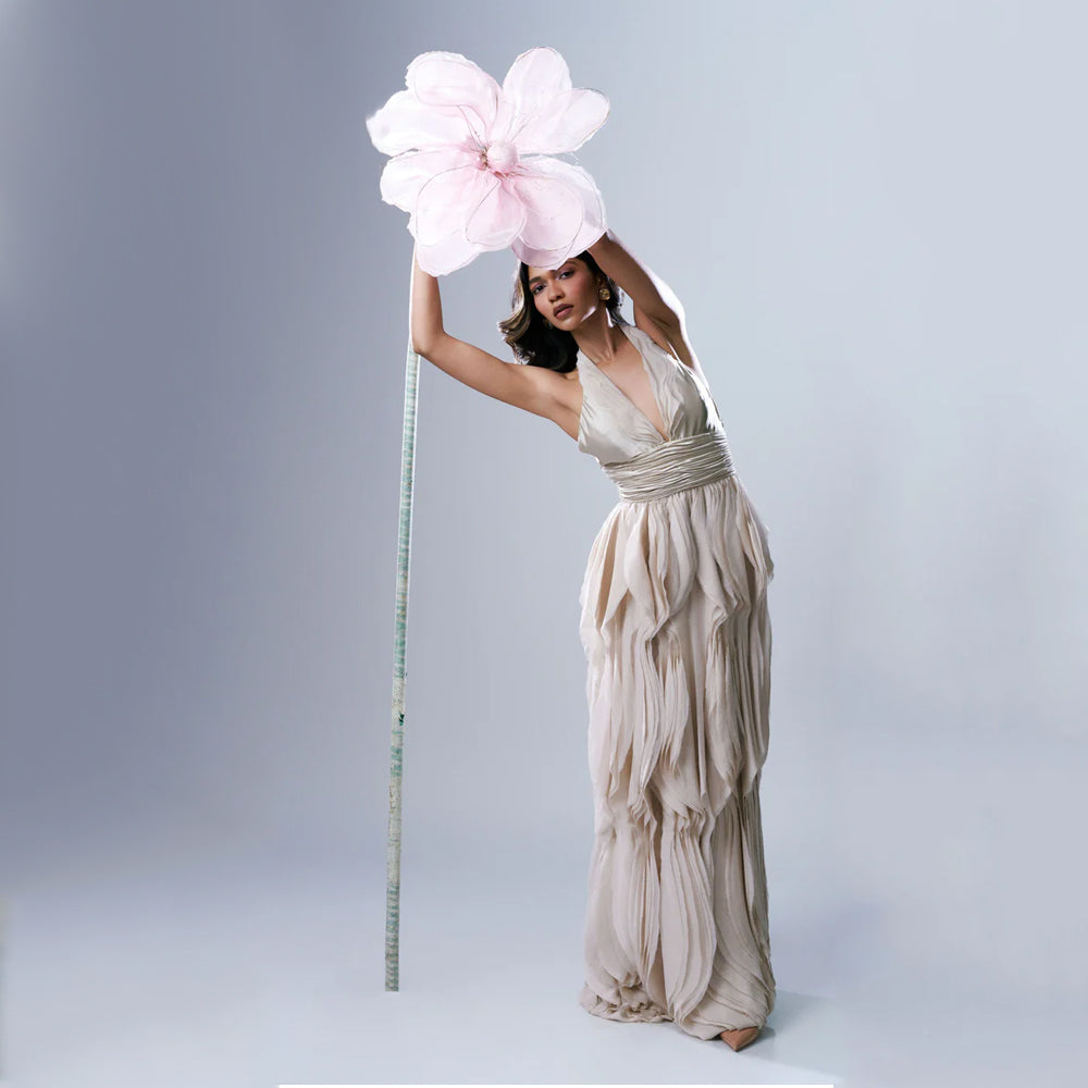Beige halter maxi dress with V-neck and ruched waist, perfect for events. Shop online from our exclusive collection of premium styles.