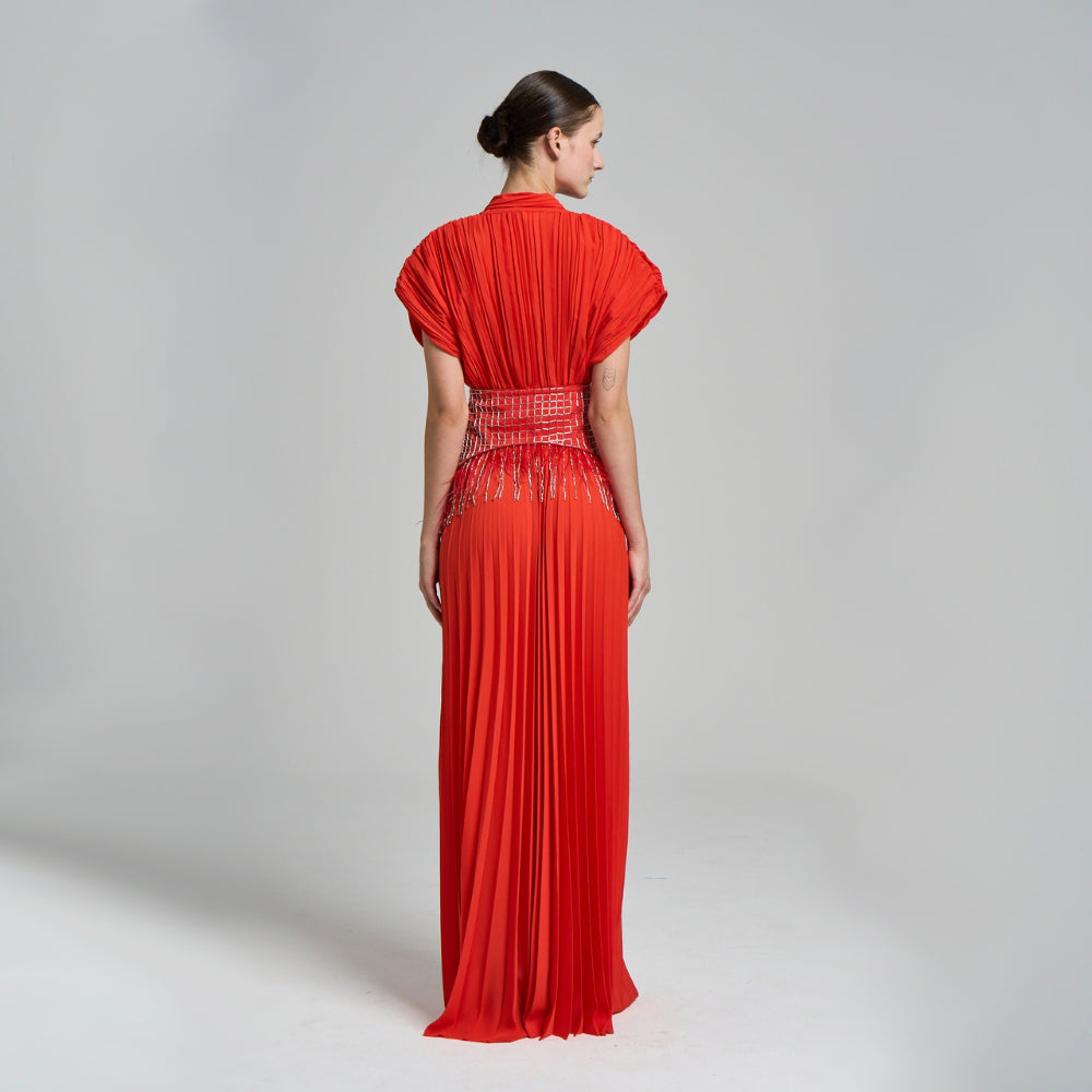 Hand embroidered belt included .Pleated .Fringe details .Short sleeved .Waist elastic detail .Maxi evening dress