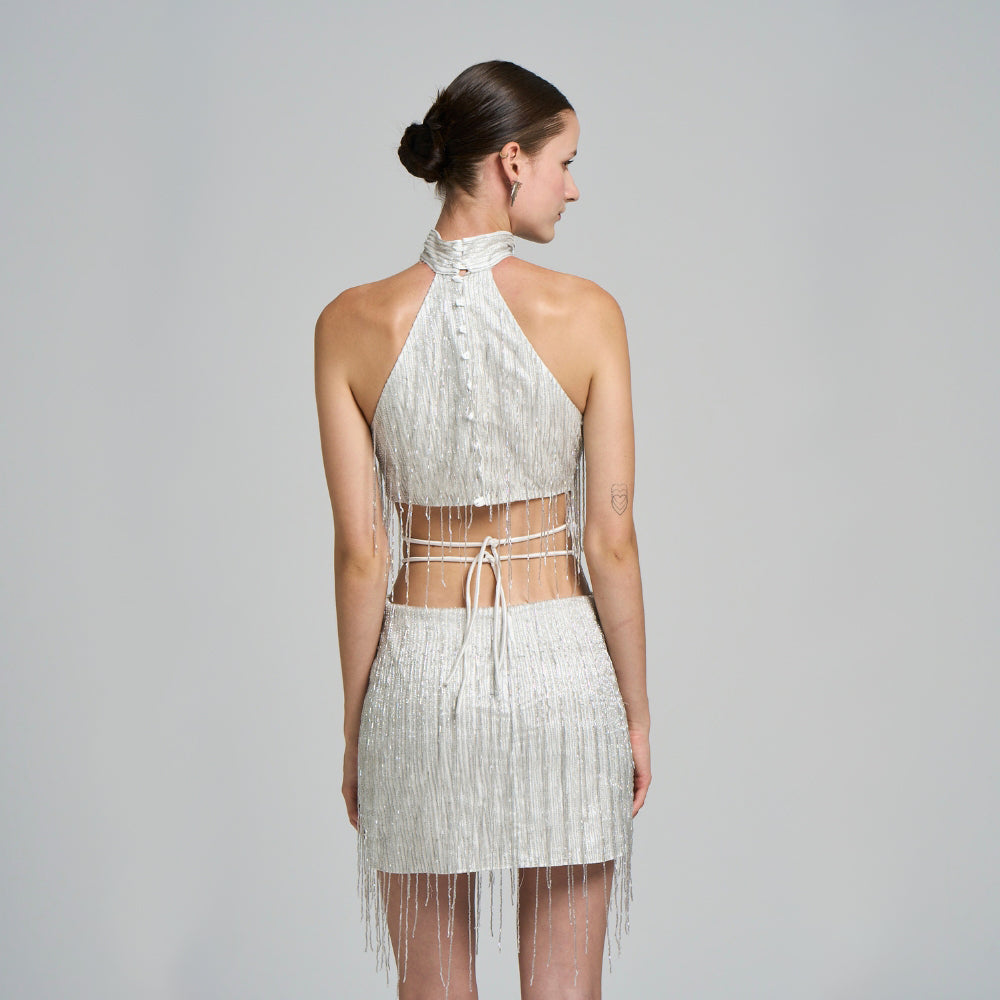 Embroidered fabric .Fringe detail .Hand embroidered .Halter collar .With button closure.Mini evening dress